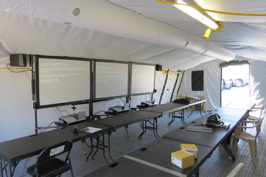 CAMSS 20TAC Rapid Deployment Military Shelter Interior - Office with Tables and Projectors