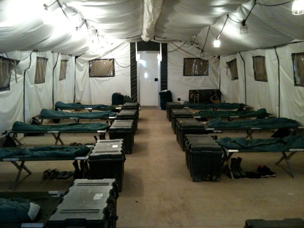 CAMSS 20EX Military Shelter Interior View of Cots and Storage Containers