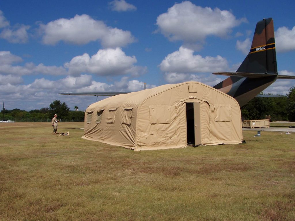 CAMSS 20EX Tan Military Shelter Near Aircraft