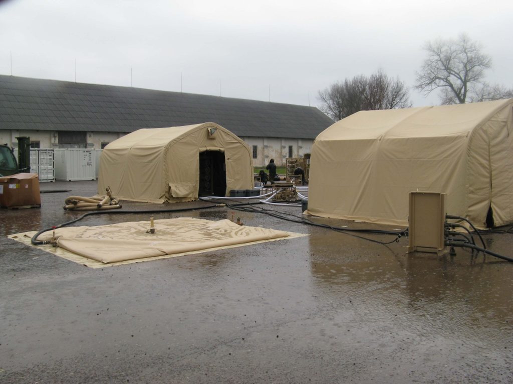 CAMSS: Tan CAMSS 16EX Military Shelter with ROWPU Deflating Water Reservoir in Lybia