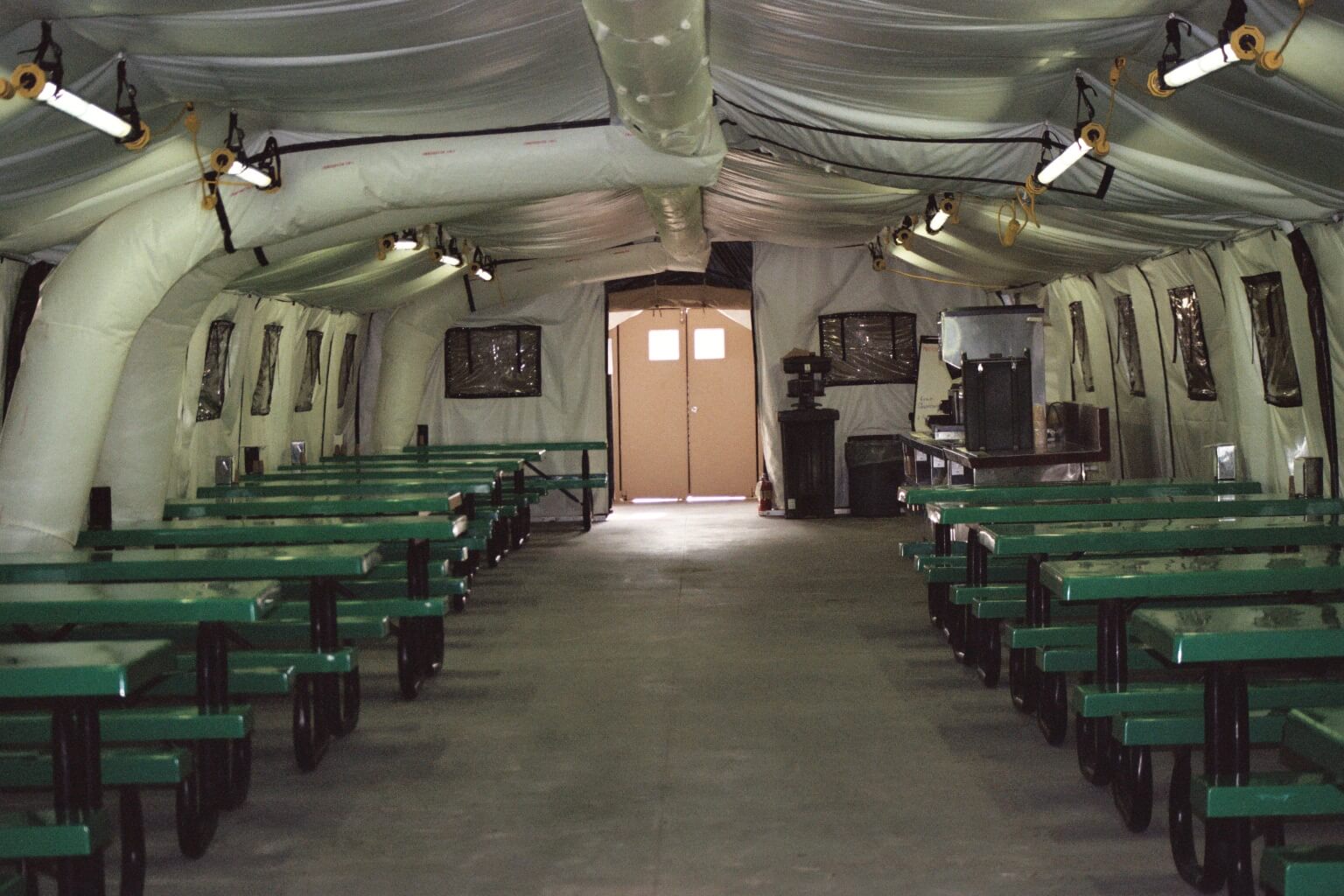 CAMSS: Green Tables in CAMSS 20EX40 Military Shelter Interior